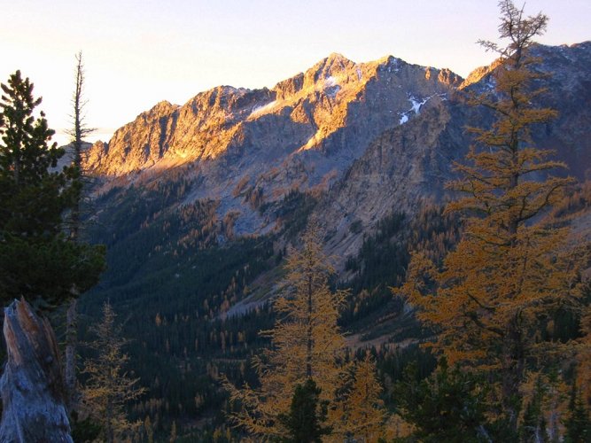 I like the warm color of the early light on the peaks and trees.